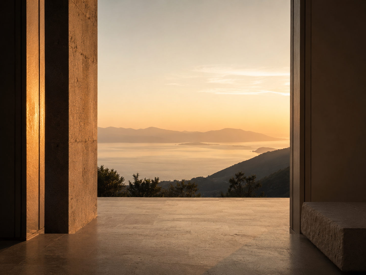 A calm horizon framed in stone, evoking reflection, humility, and a broadened perspective